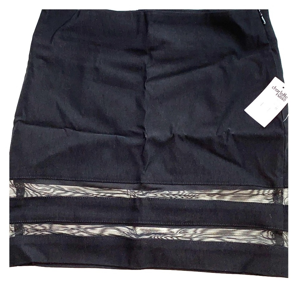 Mini black skirt with see-through detail.